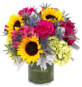 sunflowers with pink roses and greenery in short vase