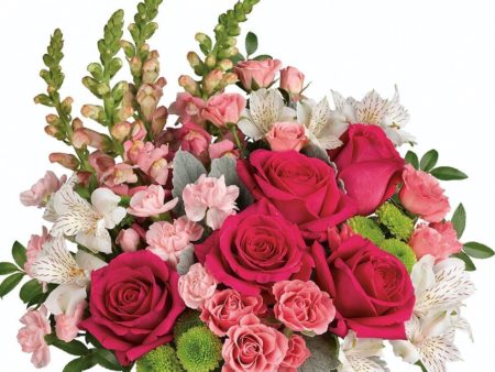 Stunning roses, delicate alstroemeria and dramatic snapdragons are hand-delivered in a classic cube vase lined with a green leaf - a surprise gift that'll touch her heart, no matter the occasion.